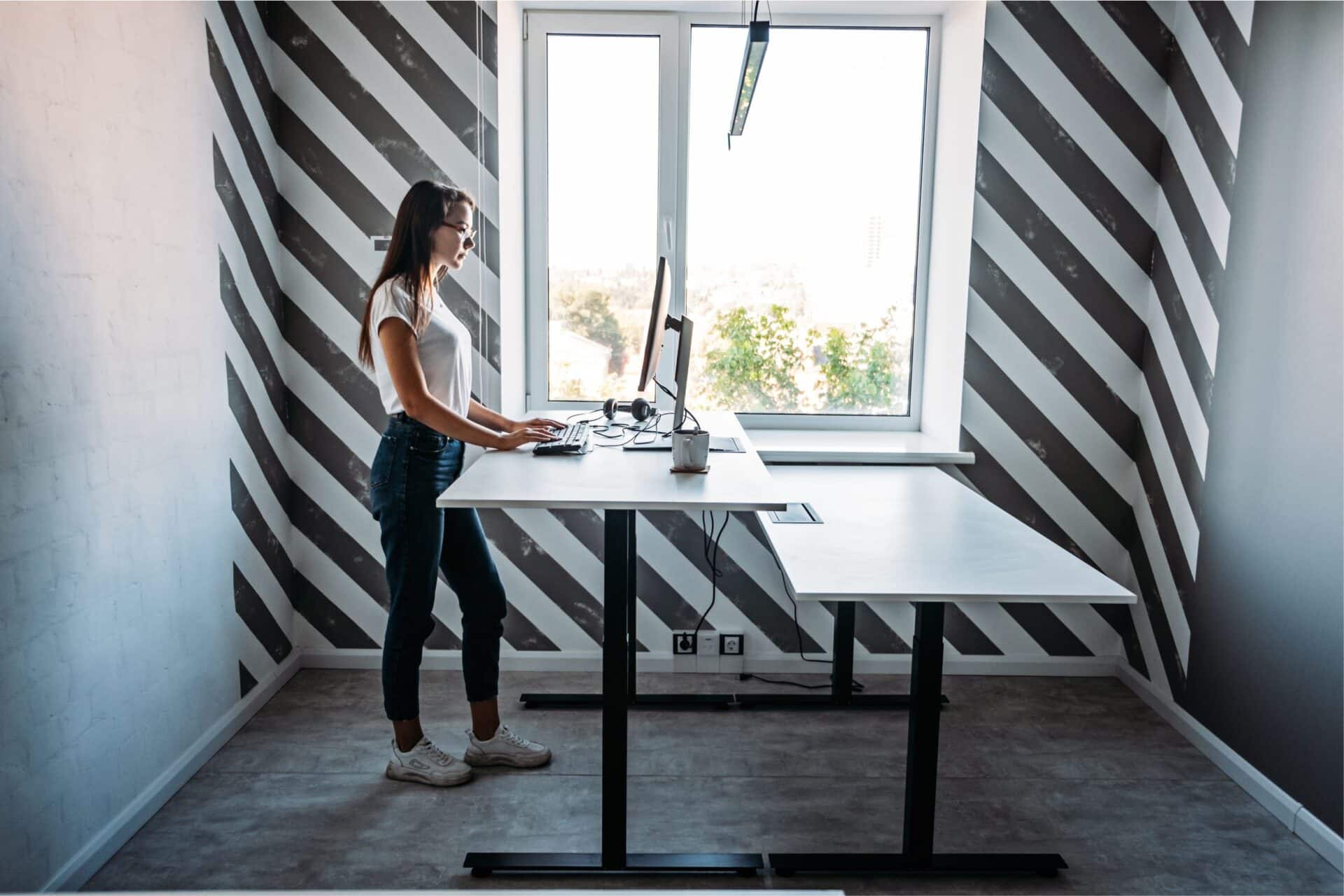 Employee working comfortably at an ergonomic desk boosting productivity